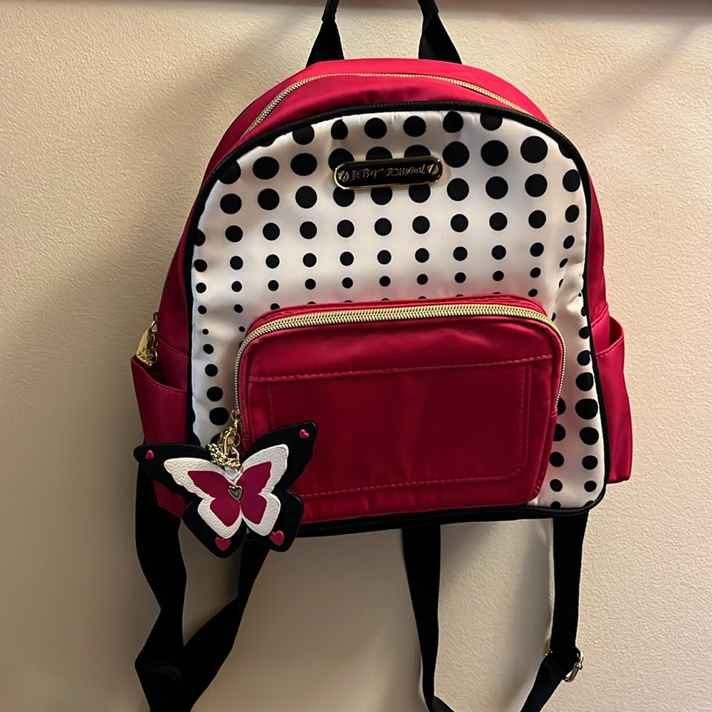 Pink, white, and black backpack!! In great condition!